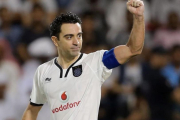 Xavi, en un partido con el Al Sadd.-AFP / KARIM JAAFAR