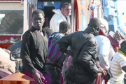Algunos de los supervivientes de la patera, en el puerto de Almería.-EFE
