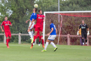 Alex Alegría, ayer titular en la punta del ataque del Numancia, salta con un jugador de la U.D. Logroñés en el partido disputado en Laguardia.-Sonia Tercero