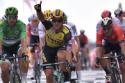El holandés Groenewegen celebra su triunfo.-AFP / MARCO BERTORELLO
