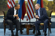 l presidente de Estados Unidos, Barack Obama, y su homólogo ruso, Vladimir Putin, en un encuentro en el Reino Unido en el 2013.-AFP / JEWEL SAMAD E