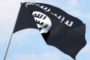 Una bandera del Estado Islámico ondeando.-