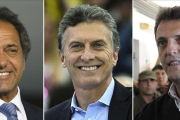 Combo de imágenes de tres de los favoritos. De izquierda a derecha: Scioli, Macri y Massa.-AFP