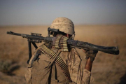 Un marine estadounidense, de regreso a su base en la provincia de Helmand (Afganistán), en el 2011.-AP / DAVID GOLDMAN