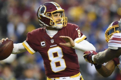 Kirk Cousins lanza el balón.-AP / NICK WASS