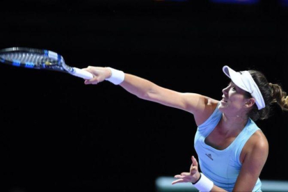 Muguruza, durante el partido frente a Radwanska en el Masters.-ROSLAN RAHMAN