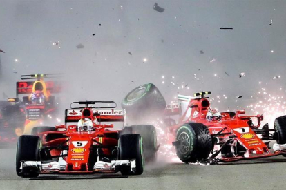 El accidente entre Vettel y Kimi Raikkonen.-EFE