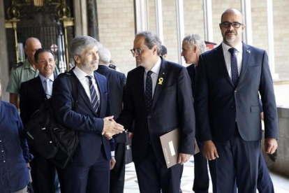 El president Torra, con el conseller Miquel Buch y el ministro de Interior, Grande-Marlaska.-RICARD CUGAT