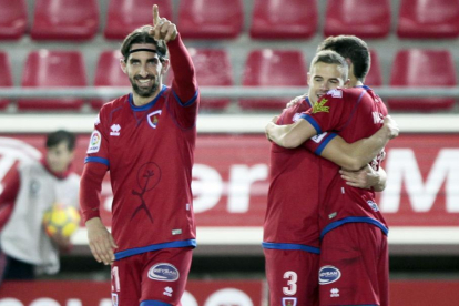Marc Mateu, Ripa y Nacho festejan uno de los goles durante el último partido del Numancia ante el Sevilla Atlético la semana pasada.-MARIO TEJEDOR