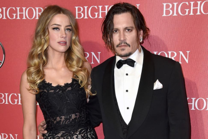 Johnny Depp y Amber Heard, el pasado enero en una gala en Palm Springs.-AP / JORDAN STRAUSS