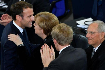 Merkel felicita a Macron tras su discurso en el Bundestag.-JOHN MACDOUGALL AFP