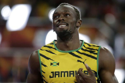 Usain Bolt en las semifinales de 100 en Pekín.-REUTERS
