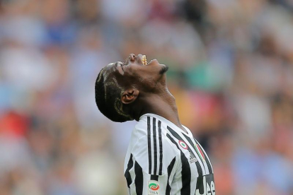 Paul Pogba se lamenta durante un partido con la Juventus.-AFP / MARCO BERTORELLO