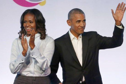 Barack y Michelle Obama.-