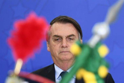 Bolsonaro preside una ceremonia militar este viernes en el Palacio Planalto.-AFP / EVARISTO SA