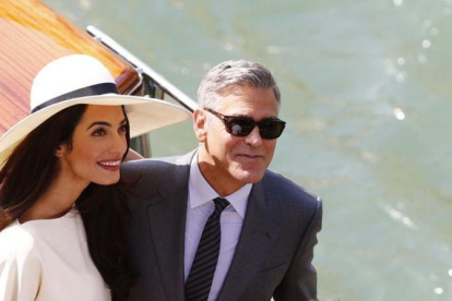 Amal y George Clooney, durante una visita al Festival de Venecia del 2014. Italia es la otra patria del intérprete norteamericano.-PIERRE TEYSSOT