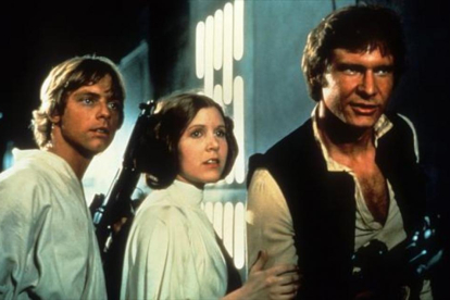 Los actores Mark Hamill, Carrie Fisher y Harrison Ford como Luke Skywalker, princesa Leia y Han Solo.-ARCHIVO
