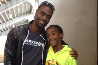 El atleta Tyson Gay y su hija, Trinity.-