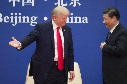 Trump y Xi en noviembre del 2017 en Pekín.-AFP / NICOLAS ASFOURI