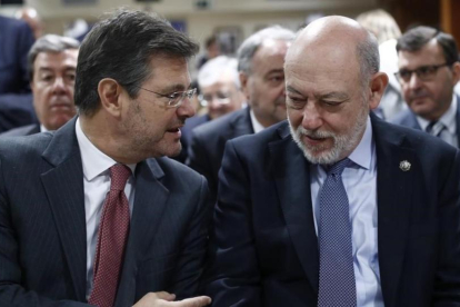 El ministro de Justicia, Rafael Catalá, y el fiscal general del Estado, José Manuel Maza, en un acto el pasado día 7 de febrero.-EMILIO NARANJO