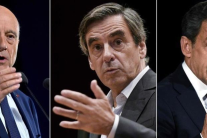 Los tres grandes favoritos en las primarias de la derecha francesa: Juppé (derecha), Fillon (centro) y Sarkozy.-AFP / LOIC VENANCE