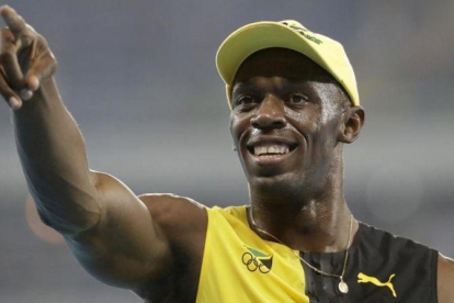 Bolt celebra su medalla de oro olímpico en Río de Janeiro.-AP / DAVID GOLDMAN