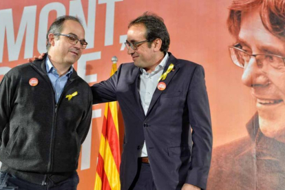 Jordi Turull y Josep Rull han  manifestado tristeza por los que han quedado en la cárcel.-EFE
