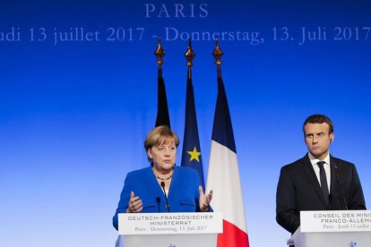 La cancillera alemana Angela Merkel y el presidente de Francia Emmanuel Macron.-Markus Schreiber