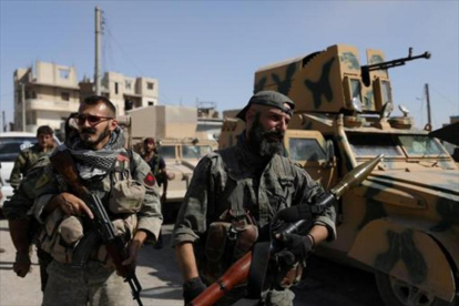 Combatientes kurdosirios en la ciudad de Raqqa.-REUTERS / RODI SAID