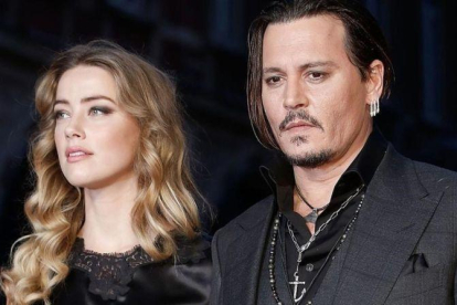 Amber Heard y Johnny Deep.-