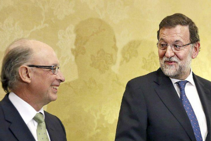 Montoro y Rajoy.-ARCHIVO / EFE
