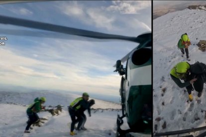 Momento en el que los rescatadores conduce al montañero y a su perro al helicóptero.