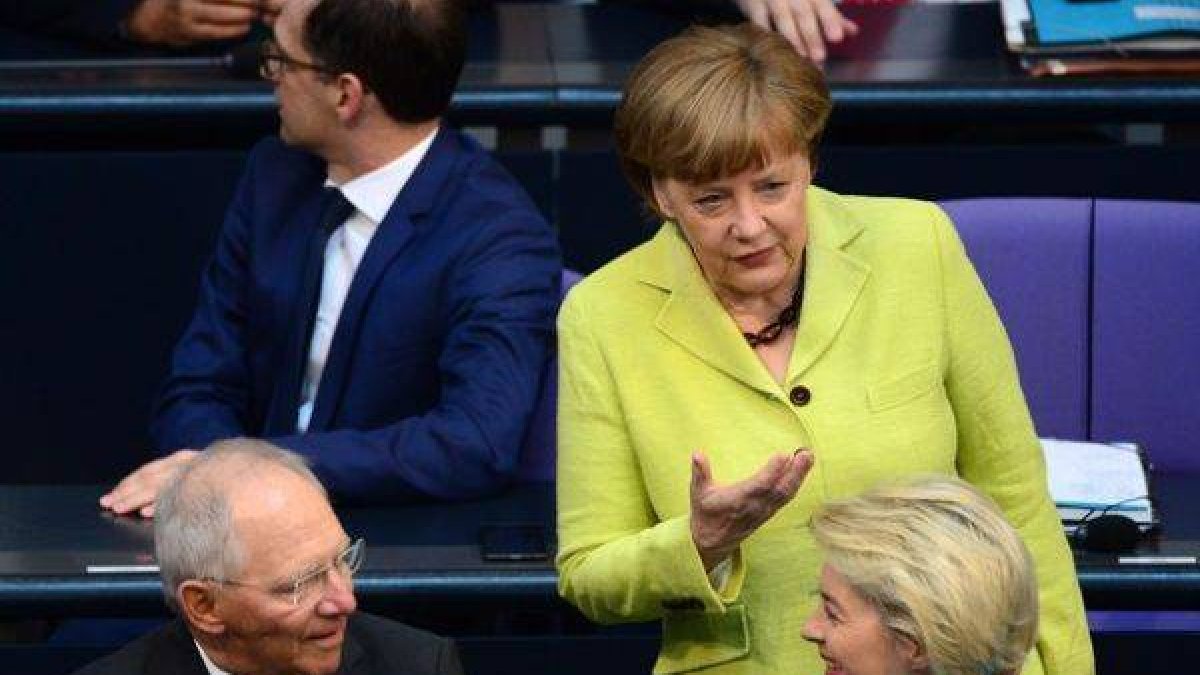 Merkel en el Bundestag, este jueves.-Foto: AFP / JOHN MACDOUGALL