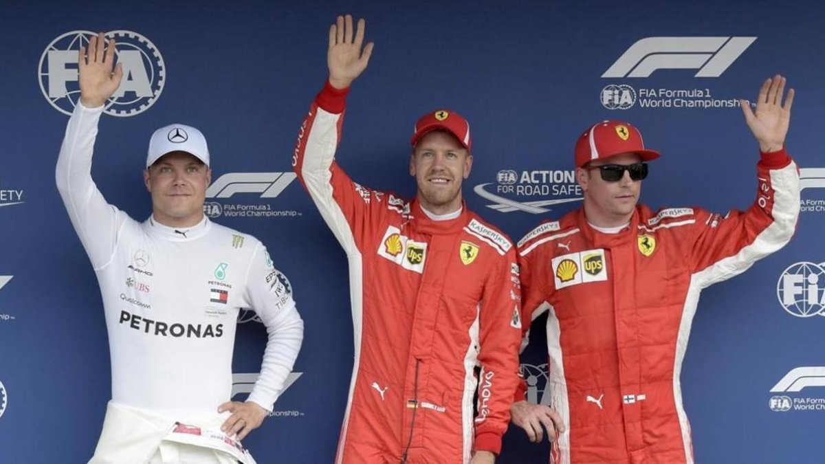 Valtteri Bottas (2º), Sebastian Vettel (1º) y Kimi Raikkonen (3º), en los últimos ensayos hoy del GP de Alemania. /-AP / JENS MEYER