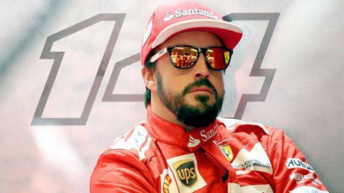 Fernando Alonso, en el box de Ferrari, durante un descanso del GP de EEUU.-Foto: EFE / SRDJAN SUKI