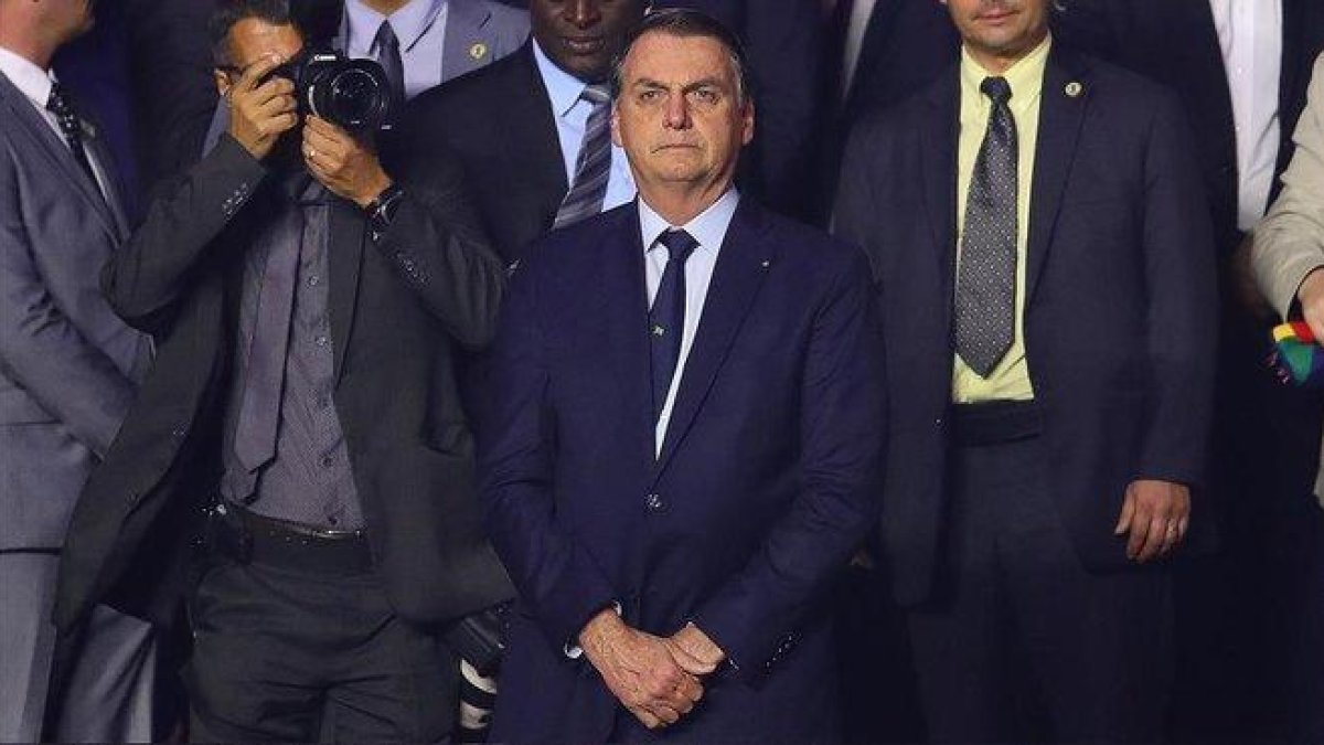 El presidente brasileño, Jair Bolsonaro, durante un encuentro de la Copa América entre Brasil y Bolivia, este viernes, en Sao Paulo.-CHRIS BRUNSKILL (GETTY IMAGES)