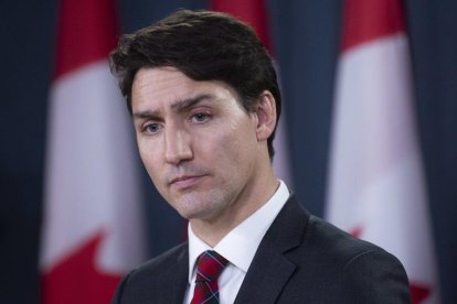 Canadian Prime Minister Justin Trudeau listens to a question during an end of session news conference in Ottawa-CANADIAN PRESS