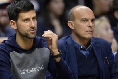 Djokovic, de espectador, en un reciente partido de la NBA.-USA TODAY / GARY A. VASQUEZ