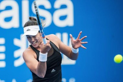 Garbiñe Muguruza, en pleno partido.-STR / AFP