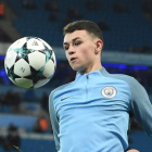 Foden, del Manchester City, en el calentamiento de un partido de la Champions.-AFP / OLI SCARFF