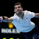 Grigor Dimitrov, en una jugada de su partido ante Dominic Thiem-AP / KIRSTY WIGGLESWORTH