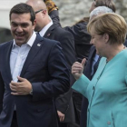 Merkel conversa con el primer ministro griego, Alexis Tsipras.-Merkel conversa con el primer ministro griego, Alexis Tsipras.