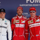 Bottas (3º), Vettel (1º) y Raikkonen (2º), celebran las primeras posiciones en la parrilla del GP de Rusia.-REUTERS