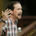 El secretario general de Podemos, Pablo Iglesias, en la tribuna del Congreso.-EFE / JUANJO MARTIN