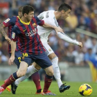 Leo Messi y Cristiano Ronaldo, durante un Barça-Madrid.-JORDI COTRINA