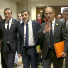 Josep Rull, Jordi Sánchez y Jordi Turull, a su salida tras realizar el trámite.-DAVID CASTRO