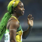 Fraser-Pryce, con los colores de la bandera jamaicana en el pelo.-REUTERS / LUCY NICHOLSON