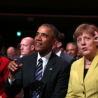 Obama y Merkel en la feria industrial de Hanover (Alemania).-AFP / RONNY HARTMANN