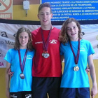 Los nadadores Marina Gil, Sergio Martín y Carmen López. / C.N. SORIANO-