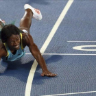 Shauane Miller se tira en plancha a la línea de meta para ganar el oro en los 400 metros.-ANTONIO LACERDA